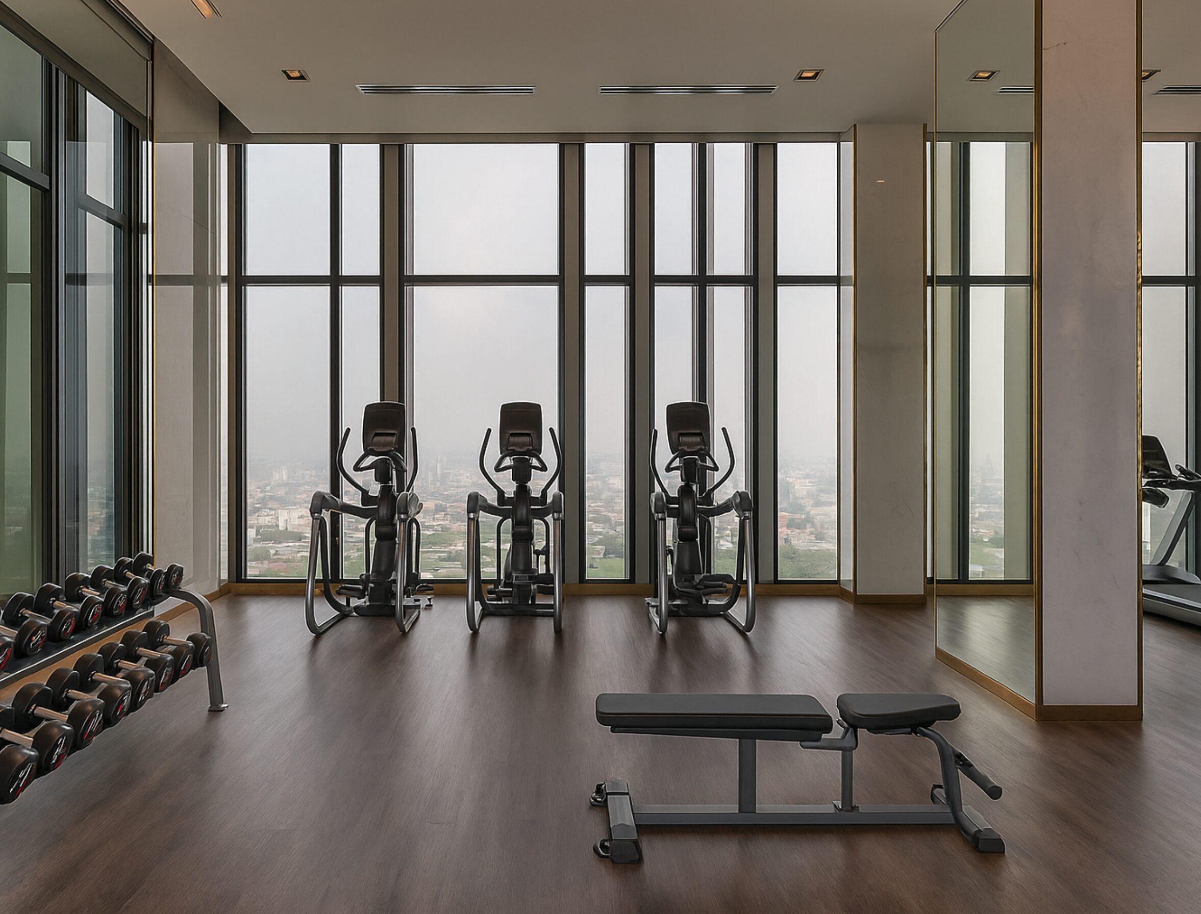 Fitness center with city skyline view at Life One Wireless Bangkok.